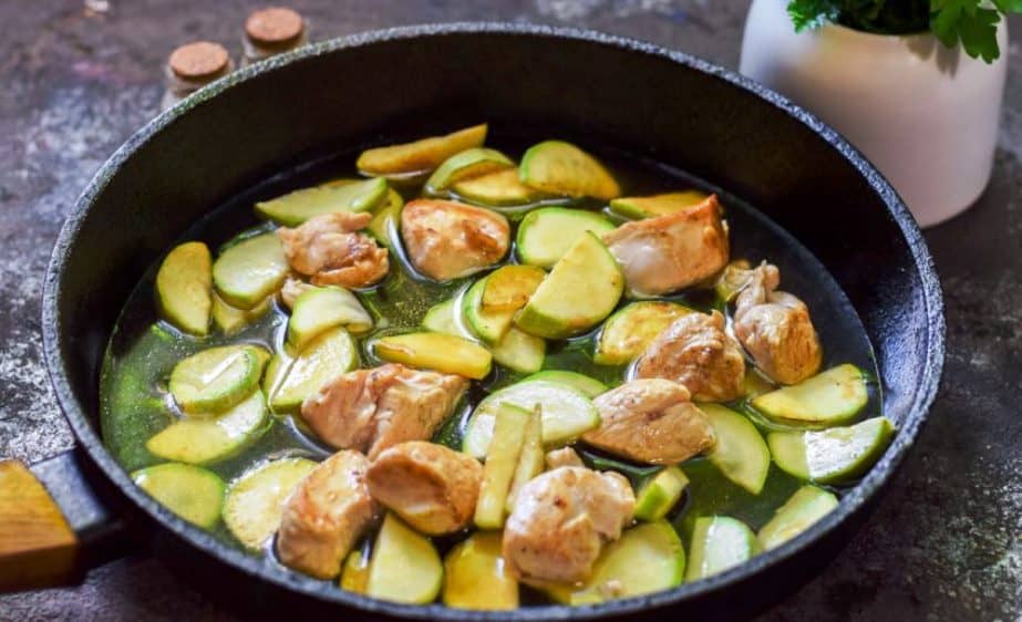 Chicken with zucchini in a pan