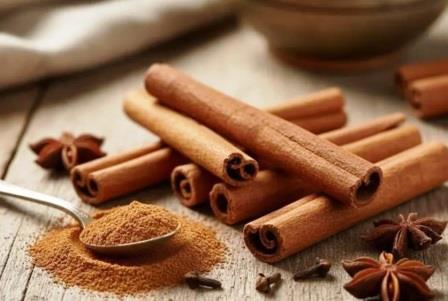 Cinnamon sticks and a hammer